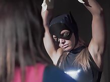 Batgirl caught Supergirl and had lots of joy tormenting her, before they determined to change roles