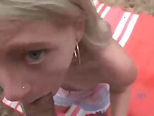 Blue- saw light-haired, Kate Bloom is inhaling a fat dinky in the nature, just for joy