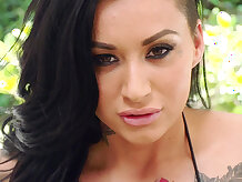 Alby Rydes showing off her ass and big tits in a skimpy bikini